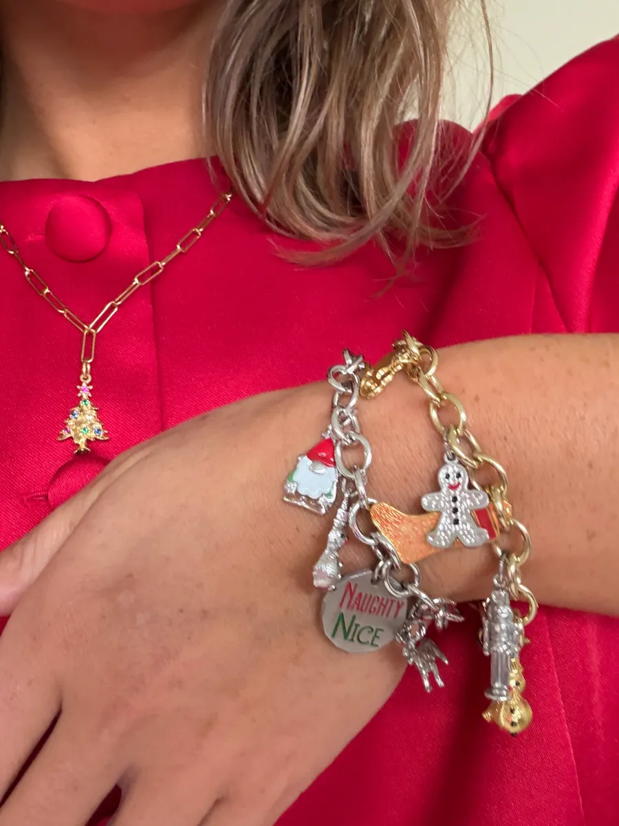 Charm bracelet with gingerbread, Santa and Naughty or Nice charms worn with a tree pendant necklace